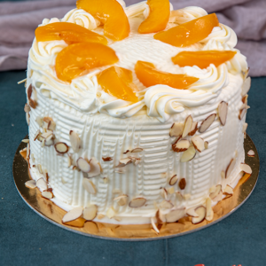 Peaches and Cream Cake by Goodies Bakery